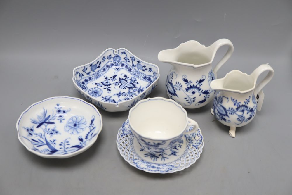 Two Meissen jugs, a cup and saucer and two dishes in blue and white onion pattern, tallest 14cm